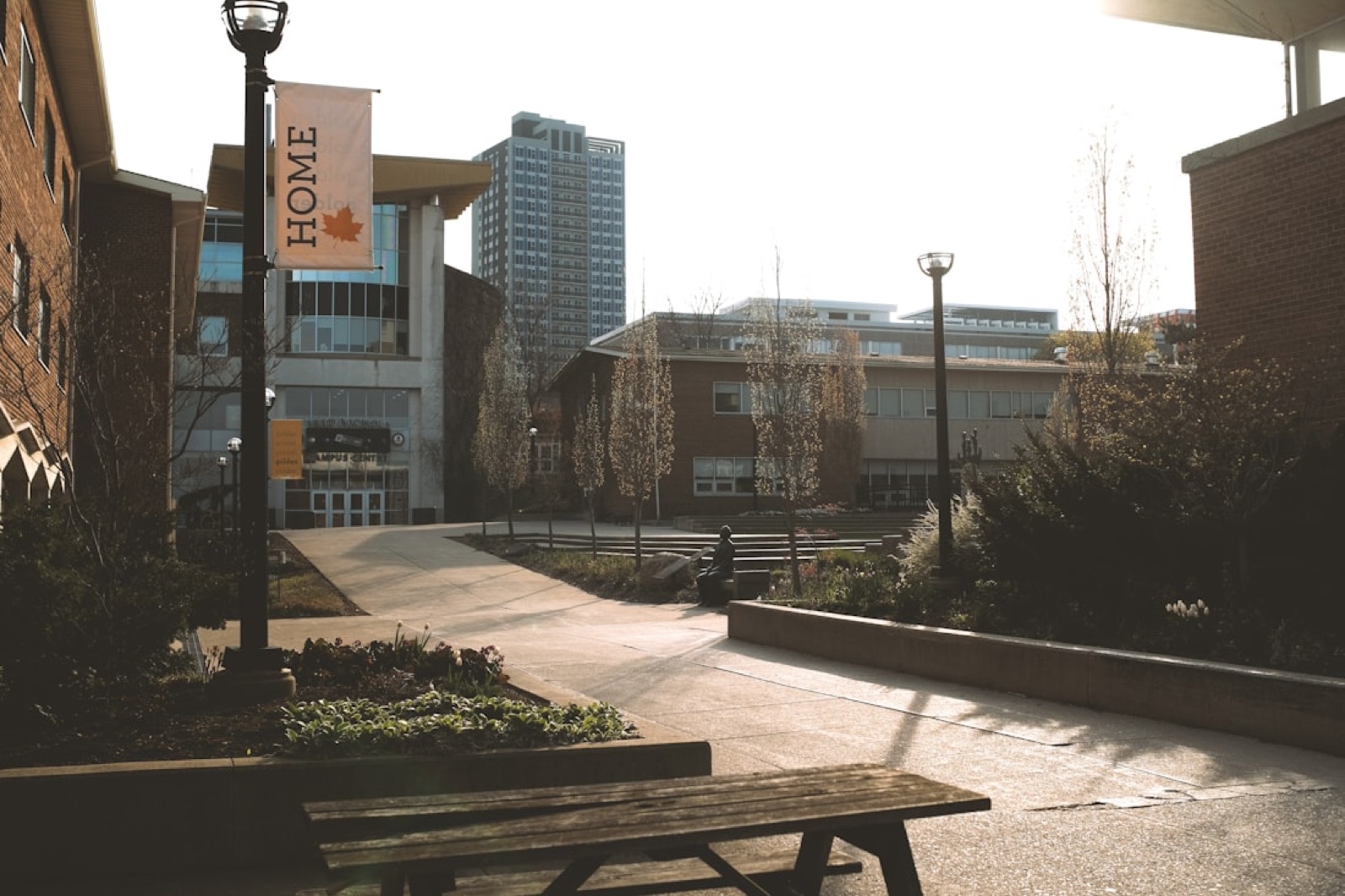 An empty university campus courtyard in low winter sun